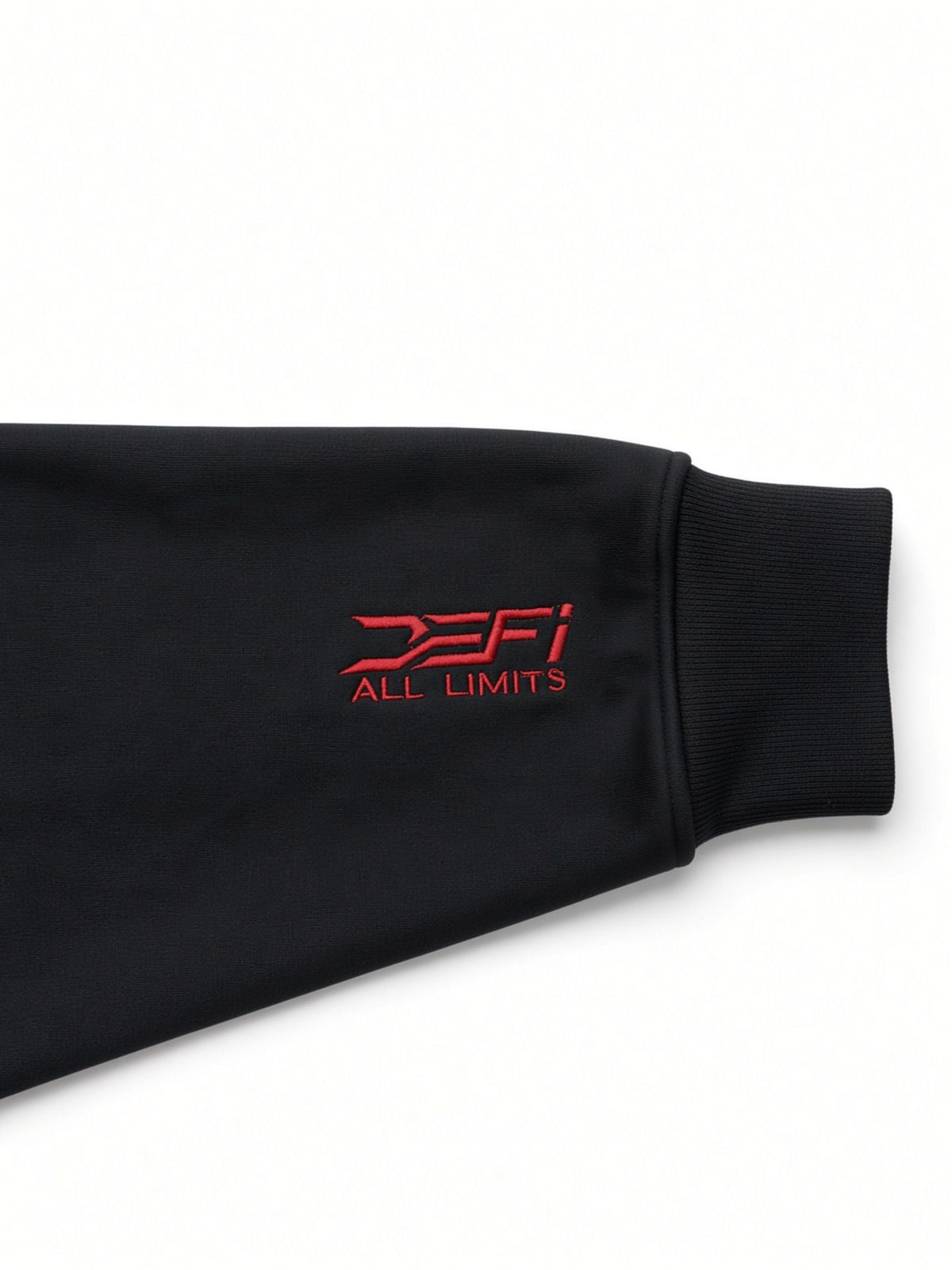 Red DEFI All Limits print on the cuff of the black DEFI Motorsports hoodie