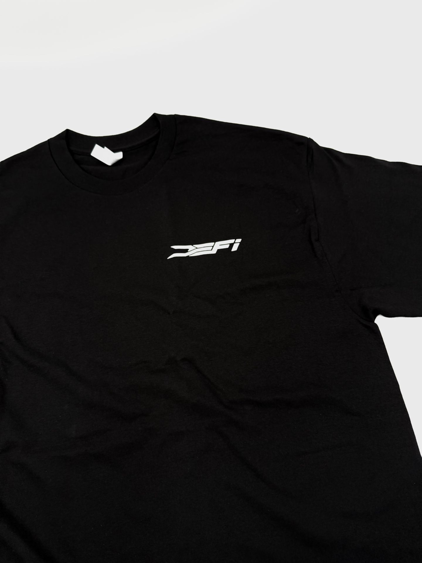 Black DEFI Motorsports t-shirt, front, with the mark on the chest