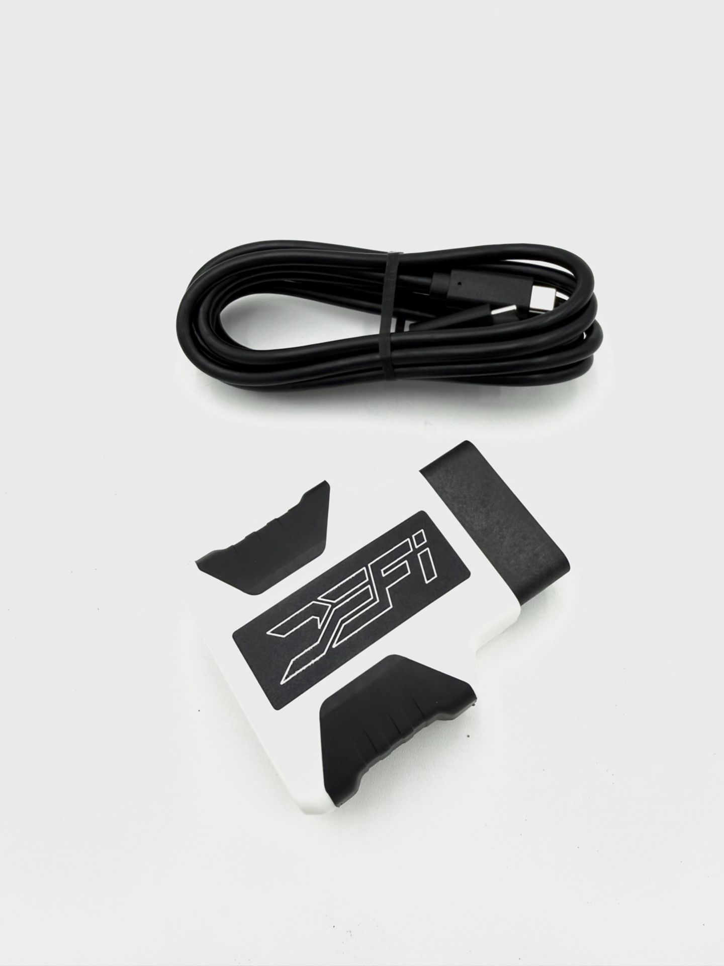 The DEFI Motorsports RTD interface and cable laid out, as supplied