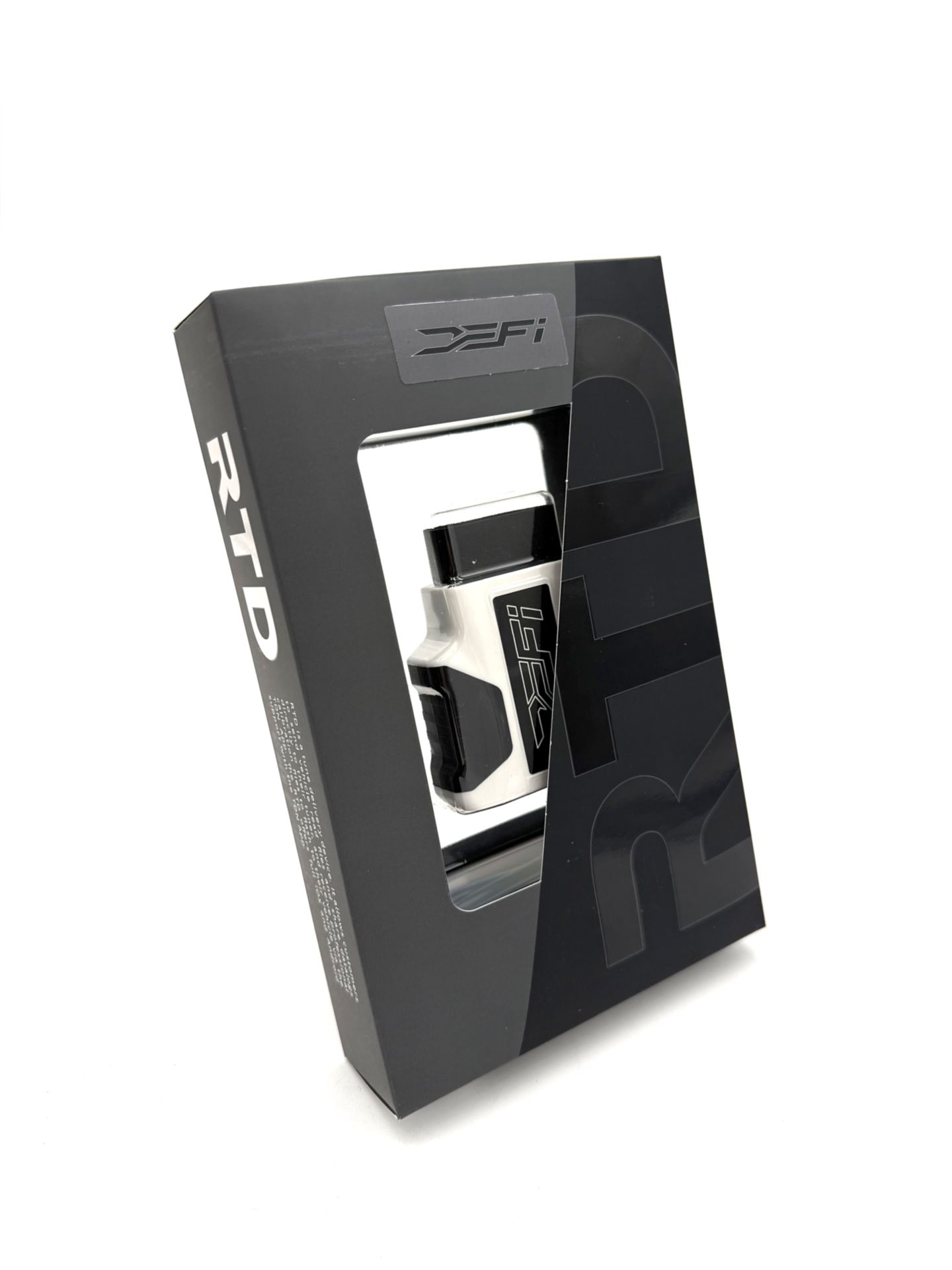 The DEFI Motorsports RTD interface device and package contents