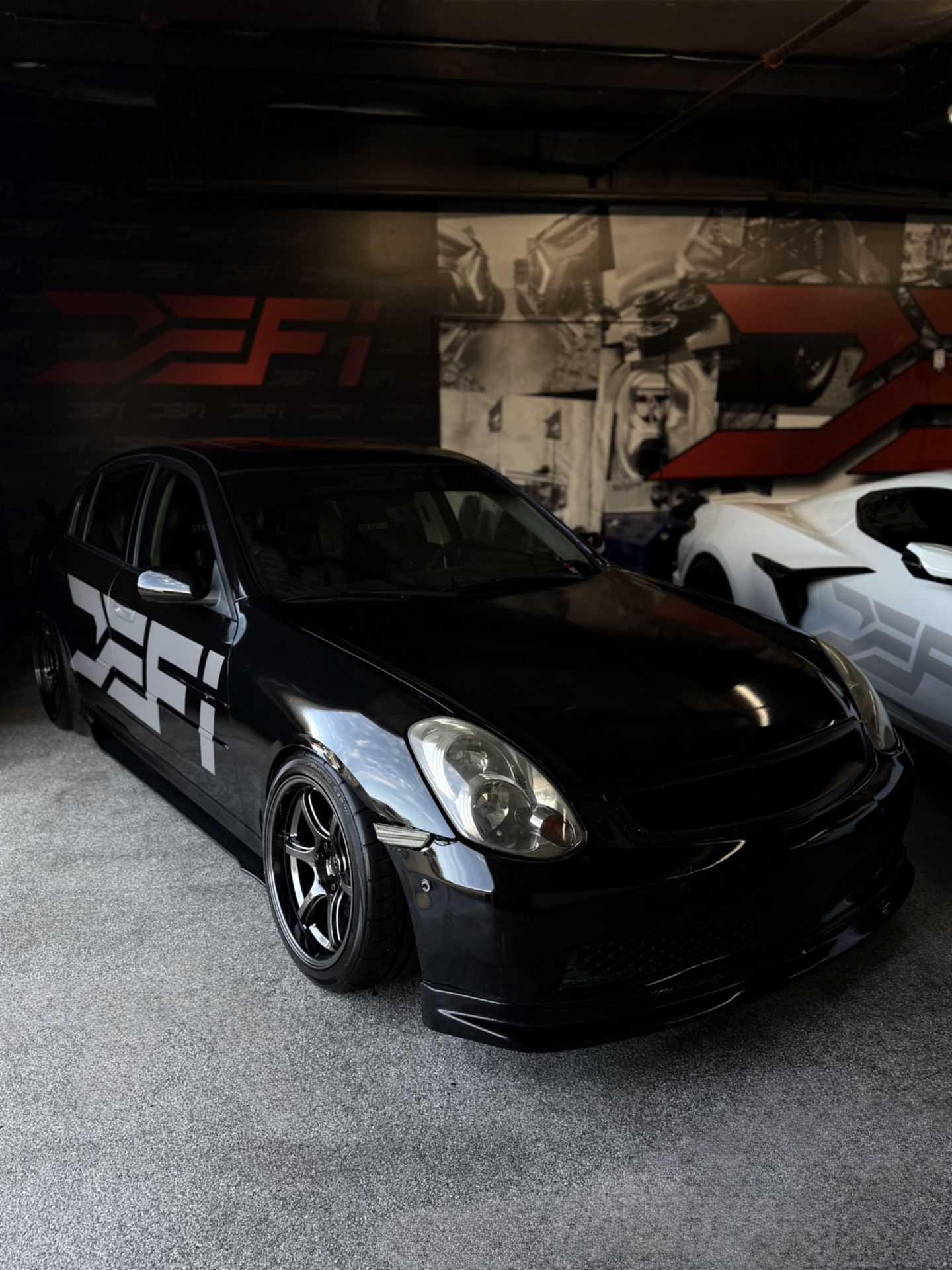Infiniti G35 in the DEFI Motorsports workshop