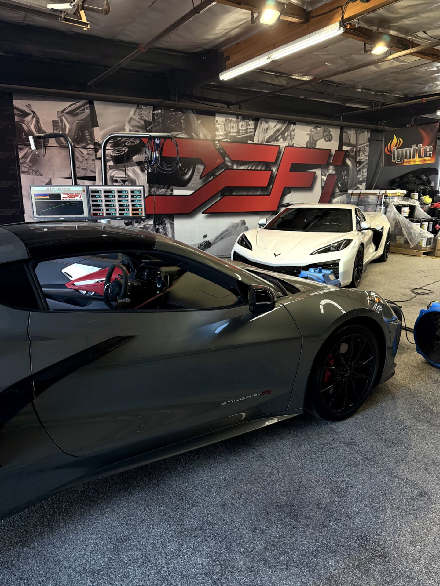 A vehicle bolted to the hubs of the Mainline ProHub dyno at DEFI Motorsports
